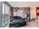 Comfortable living room featuring modern gray walls, stylish decor, and natural light from the sliding glass door at 8475 E 36Th Ave # 337, Denver, CO 80238