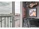 Bright living room with a balcony view, stylish shelving and decor, and a cozy seating area at 8475 E 36Th Ave # 337, Denver, CO 80238