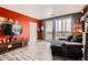 A living room featuring a gray couch, a balcony and lion picture at 8475 E 36Th Ave # 337, Denver, CO 80238
