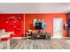 A living room with a TV, climbing tree for cats, and bar stools at counter at 8475 E 36Th Ave # 337, Denver, CO 80238