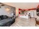 A living room featuring an open kitchen, couch, and cat climbing tree at 8475 E 36Th Ave # 337, Denver, CO 80238
