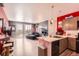 Modern living room with an open floor plan, balcony, updated kitchen and stylish décor at 8475 E 36Th Ave # 337, Denver, CO 80238
