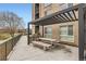 Outdoor patio with a pergola, barbecue grill, and picnic tables, perfect for entertaining and enjoying outdoor dining at 8475 E 36Th Ave # 337, Denver, CO 80238