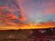 Picturesque sunrise over a residential neighborhood in Colorado with bright orange and blue colors at 8475 E 36Th Ave # 337, Denver, CO 80238