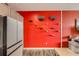 A wall with climbing apparatus for cats next to a gray kitchen with white counters at 8475 E 36Th Ave # 337, Denver, CO 80238