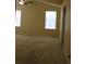 Spacious bedroom with two bright windows at 213 Mesa St, Brighton, CO 80601