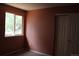 Cozy bedroom with a window view and closet storage space at 213 Mesa St, Brighton, CO 80601