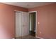 Bedroom featuring a double door closet and neutral paint at 213 Mesa St, Brighton, CO 80601