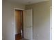 Bedroom view showcasing open doorway and closet space at 213 Mesa St, Brighton, CO 80601