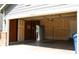 An empty garage with exposed beams is ready for customization at 213 Mesa St, Brighton, CO 80601