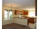 Bright kitchen with wood cabinets, a breakfast bar and natural light at 213 Mesa St, Brighton, CO 80601