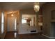 Bright living room adjacent to the kitchen with neutral color palette at 213 Mesa St, Brighton, CO 80601