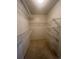Walk-in closet with wire shelving providing ample storage space at 213 Mesa St, Brighton, CO 80601