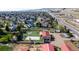 Beautiful property featuring a sport court, lush backyard, and well-maintained outbuildings at 5400 S Alkire St, Littleton, CO 80127