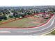 Expansive horse property featuring lush pasture, barn, and arena for equestrian enthusiasts at 5400 S Alkire St, Littleton, CO 80127