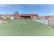 Large backyard with a manicured lawn, and an outdoor covered deck at 5400 S Alkire St, Littleton, CO 80127