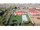Lush backyard features a basketball court, pond and beautiful landscaping, creating a serene escape at 5400 S Alkire St, Littleton, CO 80127