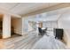 Spacious basement with vinyl floors includes a seating area and access to other rooms at 5400 S Alkire St, Littleton, CO 80127