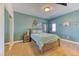 Cozy bedroom with carpet, a queen-sized bed, and soft green walls for a relaxing atmosphere at 5400 S Alkire St, Littleton, CO 80127