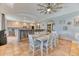 Open concept dining room featuring seating for eight, with convenient access to the kitchen area at 5400 S Alkire St, Littleton, CO 80127