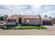 Charming single-Gathering home with a well-maintained lawn, arched entryway, and a two-car garage at 5400 S Alkire St, Littleton, CO 80127