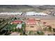 Aerial view of equestrian estate including a sport court, large yard, and multiple outbuildings at 5400 S Alkire St, Littleton, CO 80127