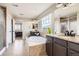 Bright bathroom with double vanity, soaking tub, and views from the large window to the exterior mountain range at 9527 Iron Mountain Way, Arvada, CO 80007