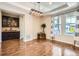 Elegant dining room with dark wood floors and modern lighting fixtures at 9527 Iron Mountain Way, Arvada, CO 80007