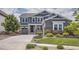 Charming two-story home with well-manicured lawn and landscaping at 9527 Iron Mountain Way, Arvada, CO 80007