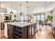 Spacious kitchen with granite island, wine rack, stainless appliances and mountain views at 9527 Iron Mountain Way, Arvada, CO 80007