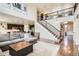 Open floor plan with a view of the staircase, living room, and modern kitchen at 9527 Iron Mountain Way, Arvada, CO 80007