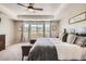 Bright main bedroom featuring mountain views from a large window with stylish curtains at 9527 Iron Mountain Way, Arvada, CO 80007