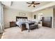 Main bedroom with a decorative sign and a view into the attached bathroom at 9527 Iron Mountain Way, Arvada, CO 80007