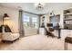 Comfortable home office with lots of natural light, built-in bookshelves, and neutral decor at 9527 Iron Mountain Way, Arvada, CO 80007