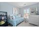Inviting bedroom with a daybed, chandelier, artwork and bright natural light at 6139 Raleigh Cir, Castle Rock, CO 80104
