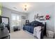 Charming bedroom with a comfortable daybed, a dark-toned color scheme, and ample natural light at 6139 Raleigh Cir, Castle Rock, CO 80104