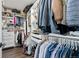 Walk-in closet with custom shelving, hanging rods and plenty of space for clothes and accessories at 6139 Raleigh Cir, Castle Rock, CO 80104