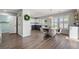 Stylish dining area features hardwood floors, a modern light fixture, and an open layout at 6139 Raleigh Cir, Castle Rock, CO 80104
