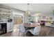 Inviting dining area featuring hardwood floors, a pendant light, and a bar area at 6139 Raleigh Cir, Castle Rock, CO 80104