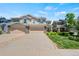 Charming townhome featuring stone accents, a two-car garage and well-maintained landscaping at 6139 Raleigh Cir, Castle Rock, CO 80104
