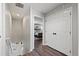 Hallway with stairway and view into the primary bedroom at 6139 Raleigh Cir, Castle Rock, CO 80104