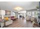 Cozy living room featuring hardwood floors, natural light, and an open floor plan at 6139 Raleigh Cir, Castle Rock, CO 80104