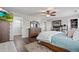 Primary bedroom with king bed, dresser, and view into the walk-in closet at 6139 Raleigh Cir, Castle Rock, CO 80104