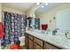 Bathroom featuring a granite countertop and a Marvel themed shower curtain at 10811 Chambers Way, Commerce City, CO 80022