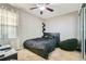 This bedroom features a modern design with a black and silver color scheme at 10811 Chambers Way, Commerce City, CO 80022