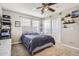Bedroom featuring a bed, closet, shelving and fan lighting at 10811 Chambers Way, Commerce City, CO 80022