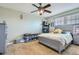 Comfortable bedroom featuring a ceiling fan, neutral paint, and plush carpet at 10811 Chambers Way, Commerce City, CO 80022
