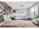 Bright and inviting living room with a modern staircase, comfortable seating, and natural light at 10811 Chambers Way, Commerce City, CO 80022