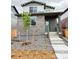 Inviting two-story home featuring stone accents, an easy-to-maintain yard, and a charming front porch at 21081 E 63Rd Dr, Aurora, CO 80019