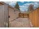 A fenced backyard offers privacy and outdoor space for recreation and gardening at 4391 W Tufts Ave, Denver, CO 80236